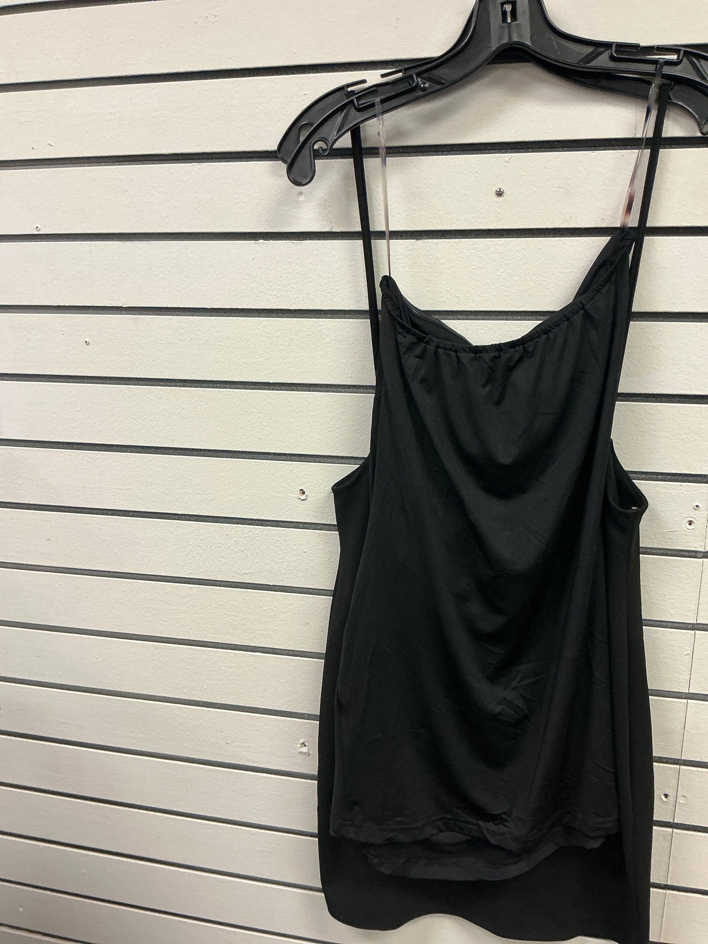 Elegant black dress with brooch on the side and ruffles