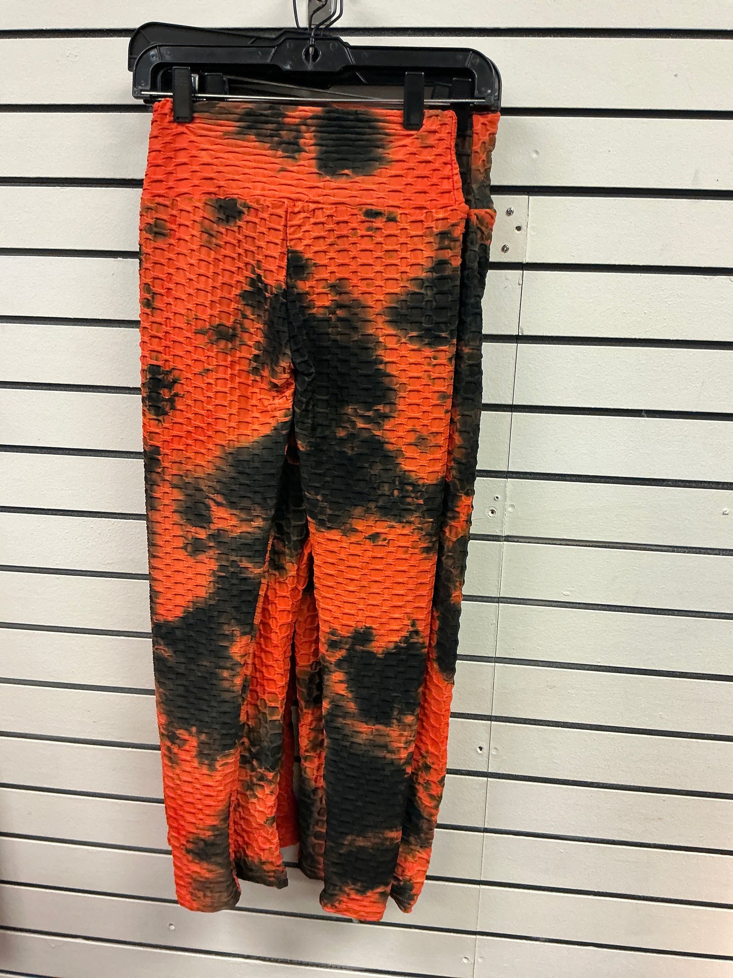 Hot, orange spandex, pants, black tie-dye