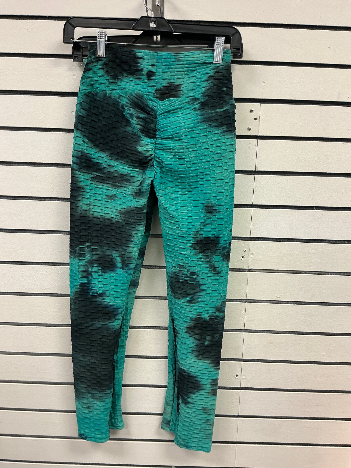 Green, black and grayish spandex pants